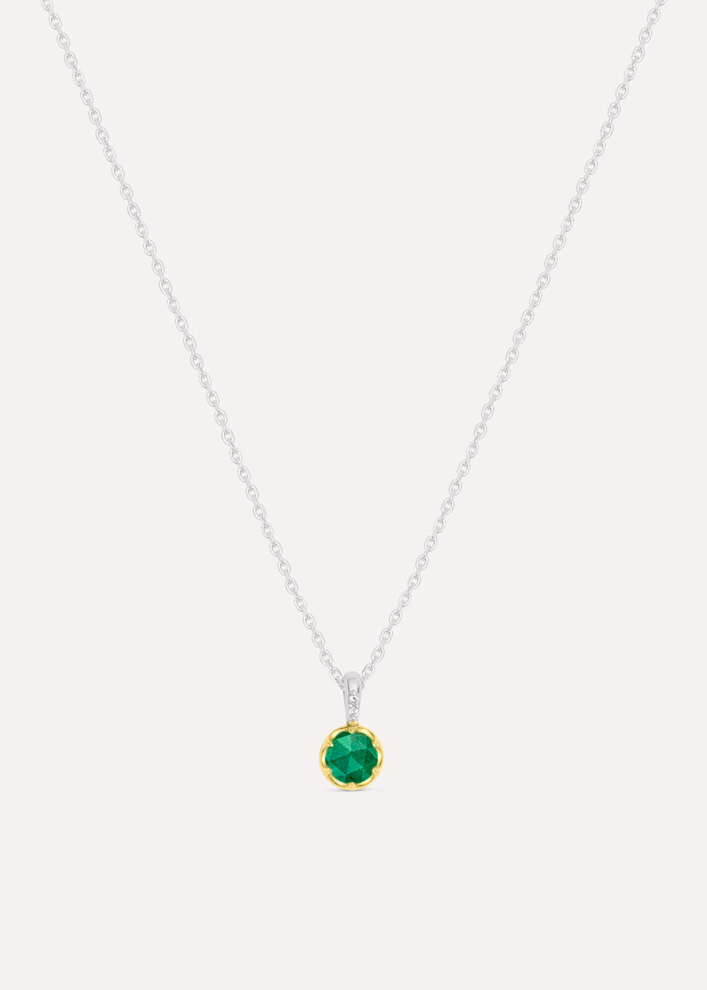 Sterling silver chain necklace with a round green emerald pendant in an 18k gold vermeil setting, front view.