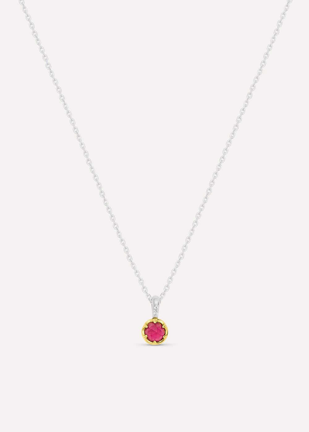 Sterling silver chain necklace with a round pink rhodolite garnet pendant in an 18k gold vermeil setting, front view.